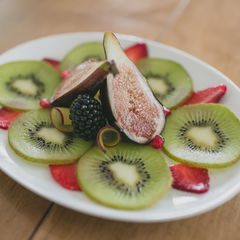 fruit plate kiwi fresh fig blackberry strawberry pomegranate seeds 1
